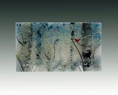 a painting on glass with trees and birds in the snow, one red bird is flying away