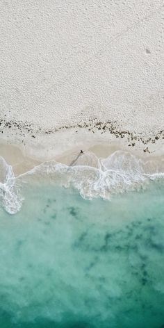 an aerial view of the beach and ocean