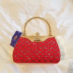 Red And Gold Appiah Evening Purse. Festive Red Bag For Gift Occasions, Red Festive Gift Bags, Festive Red Bags For Gifts, Festive Red Gift Bags, Red Shoulder Bag For Festive Gift, Festive Red Shoulder Bag As Gift, Festive Red Shoulder Bag For Gifts, Chic Red Clutch With Top Handle, Chic Red Top Handle Clutch