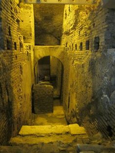 an underground tunnel with stairs leading up to it