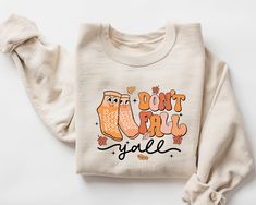 Don't Fall Y'all Sweatshirt, Fall Nurse Sweater, Nurse Thanksgiving Shirt, Fall Vibes Shirt, Pumpkin Nurse Life Sweatshirt,Fall Season Shirt This shirt has a hand pressed design. It has a very soft touch that you will feel comfortable for a long day. HOW TO ORDER ** Check and Review all Photos. ** Select your item's Size and Color from drop down menus. ** Choose the Quantity you want. ** Provide personalization in personalization box if offered.(name, print color etc.) ** Click ADD TO CART. And, you can go back to add more product color for your family members or you can complete the checkout process. ** Please Click "Proceed to Check Out" ** Finally, Your order will be ready to ship 1 - 3 Business Day. Due to the nature of the fabric as well as your monitor or mobile screen colors may dif Nurse Sweater, Day List, Heat Press Printing, Name Print, Thanksgiving Shirt, Mobile Screen, Thanksgiving Shirts, Fall Sweatshirt, Nurse Life