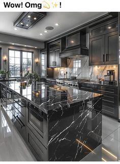 an image of a kitchen setting with marble counter tops and black cabinets in the middle