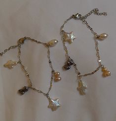 This charm bracelet is made of freshwater pearls and it's Sterling silver plated!! It's adjustable and waterproof <3 Handmade Silver Dangle Charm Bracelet, Dainty Adjustable Metal Charm Bracelet, Dainty Handmade Gold Plated Charm Bracelet, Dainty Handmade Silver Charm Bracelet, Dainty Pearl Charm Bracelet, Wedding Bracelets, Wedding Jewelry Bracelets, Bracelet Handmade, Wedding Bracelet