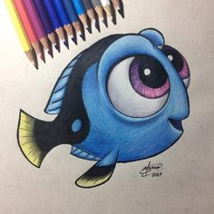 a drawing of a fish with colored pencils next to it's eyeballs