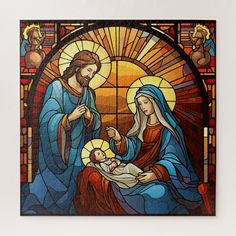 a stained glass nativity scene depicting the birth of jesus with mary and baby jesus