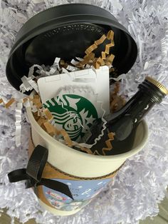 a starbucks cup filled with coffee and confetti