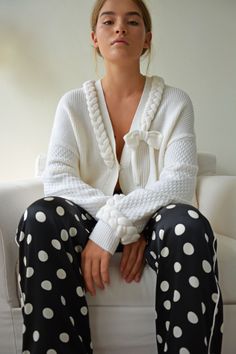 cosy winter statement cardigan made with in rich ivory with plait detailing around the neckline, pockets and cuffs in a super soft wool blend which is built to last. Cardigan is a relaxed fit. Sleeves are made in a contrast honeycomb stitch.