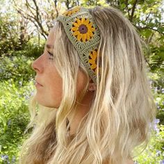 a woman with blonde hair wearing a crochet sunflower headband