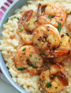 a bowl filled with rice and shrimp on top of it