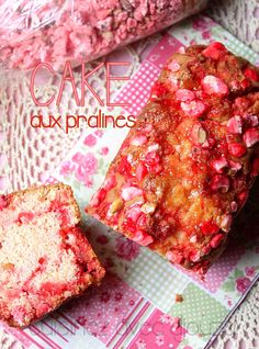 two pieces of cake sitting on top of a pink and green table cloth next to each other