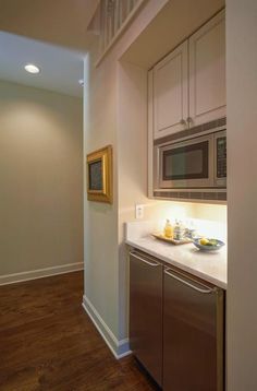 a microwave oven sitting on top of a kitchen counter