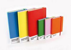 five different colors of notebooks lined up in a row on a white background with the words pantonee