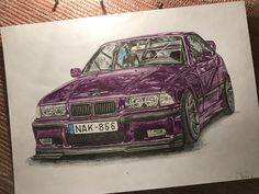 a drawing of a purple car is shown on a piece of paper that has been drawn