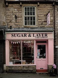 a pink store front with the words sugar and layer on it