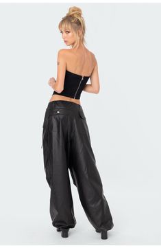 Drawcords at the waist and cuffs lend volume to these oversized pants made from faux leather. 100% polyurethane Hand wash, line dry Imported Leather Cargo Pants, Oversized Pants, Low Rise Pants, Swimwear Dress, Faux Leather Pants, Flare Pants, S Models, Model Height, Oversized Fits