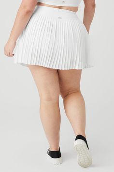 Just when the skirt sitch couldn’t get any better, we totally knocked it out of the park. The Grand Slam Tennis Skirt is the one: high-waisted, thick-banded, pleated and Airlift-sleek. We’re pairing it with our fave tanks and bra tops. Sweet, micro pleated tennis skirt Comfy inner short with side pockets Designed & uniquely fit to flatter every size Wear-tested by our in-house team for the perfect fit Alo Yoga® | Grand Slam Tennis Skirt in White, Size: 2XS Short White Tennis Skirt, Grand Slam Tennis, Pleated Tennis Skirt, Tennis Skort, Grand Slam, Tennis Ball, Tennis Skirt, Alo Yoga, Yoga Women