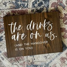 a wooden sign that says, the drinks are on us as long as you are on the dance floor