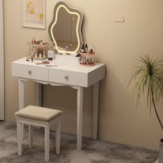 a white vanity table with a mirror and stool in front of it on a carpeted floor