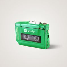 an old green camera with the word spotly printed on it's front side