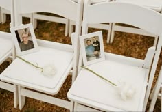 two white chairs with pictures on them and one has a single flower attached to the seat