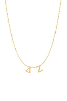 a gold necklace with two small letters on the front and one smaller letter on the back