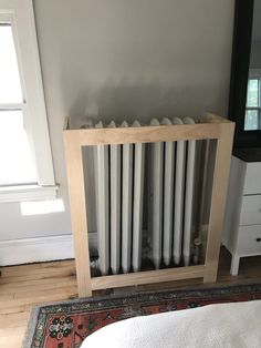 an old radiator in the corner of a room