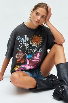 ‘90s-inspired Smashing Pumpkins graphic tee in a vintage, overdye wash. Featuring a Mellon Collie and the Infinite Sadness world tour graphic across the front & back. Perfect as an oversized graphic tee or mini dress. Only at Urban Outfitters. Features Smashing Pumpkins tour t-shirt dress Vintage back graphic tee Overdye fabric for a vintage look and feel Crew neckline with drop shoulders and short sleeves The Smashing Pumpkins tour graphics across the front and back Relaxed, oversized fit Tunic