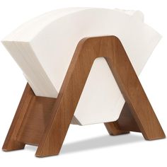 a wooden stool with two white napkins on it's legs and one in the shape of a triangle