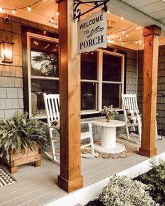 the porch is decorated with white rocking chairs and potted plants on the front porch