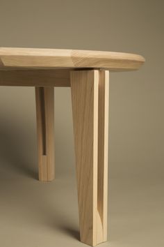 a close up of a wooden table on a gray background