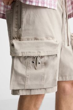 WASHED CARGO SHORTS - Stone | ZARA United States Utility Bermuda Bottoms With Built-in Shorts, Utility Shorts With Multiple Pockets, Utility Style Bottoms With Cargo Pockets, Sporty Khaki Bottoms With Patch Pockets, Casual Cotton Cargo Shorts With Elastic Waistband, Utility Style Relaxed Fit Shorts, Utility Style Cargo Shorts, Utility Shorts With Patch Pockets, Zara Cotton Bottoms With Side Pockets