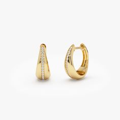 14K Solid Gold Diamond Taper Hoops: Minimalist Huggie Earrings Perfect for Daily Wear - Elegant and Understated Diamond-Adorned Hoops, An Ideal Gift for Her ▶ Details   * Made to Order * Gold KT: 14K Solid Gold (also available in 18K upon request) * Custom Gold Color: Rose Gold, Yellow Gold, White Gold * Inner Diameter: 10 MM * Outer Diameter: 13 MM * Width: Starts at 2.5MM and graduates to 6.50MM towards the Bottom * Drop: 11 MM * Round Diamonds: 34pcs  1.00 MM * Total Diamond Ctw: 0.16 ctw * Diamond Color Clarity: G Color SI Clarity  ▶ See more of our Diamond Earrings here - https://etsy.me/3YbpVq2  ▶ See our storefront here - http://etsy.me/2lUcVnH  ▶ All store sections here * Diamond Rings - http://etsy.me/2lwKUl8  * Diamond Earrings - http://etsy.me/2lyqVBP  * Diamond Necklace - http: Taper Earrings, Hoop Earrings Diamond, Teardrop Diamond, Gold Armband, Minimalist Gifts, Ruby Jewelry, Diamond Hoop Earrings, Huggie Earrings, Emerald Jewelry