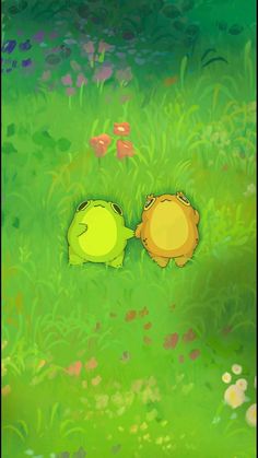 two green and yellow animals laying on top of a lush green field next to flowers