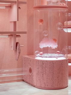 a pink display case filled with lots of bubbles