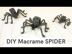 three crocheted spider sculptures sitting on top of a white tile floor with the words diy macrame spider