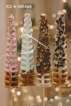 four different types of pretzels on sticks with the words ice and dreams above them