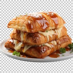 three croissants stacked on top of each other with sauce and parsley