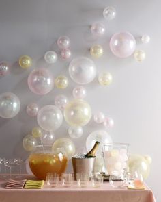 a table topped with lots of bubbles and drinks