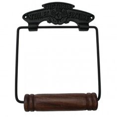 an old fashioned toilet paper holder with a wooden handle and metal bar on the front