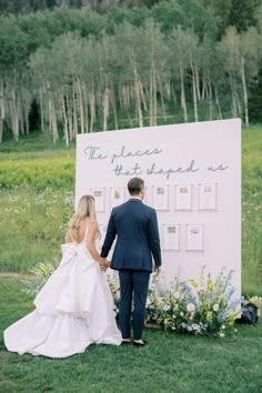 a bride and groom standing in front of a sign that says the places they stopped us