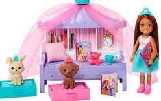 a doll house with a bed and toys