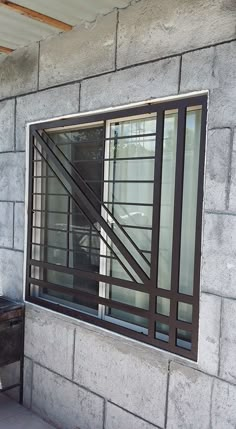 a window on the side of a building that is being constructed with concrete and steel