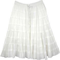 A solid white cotton skirt for summers with tiers in unfinished hem and a flouncy hemline. This short skirt is made from soft and comfortable cotton fabric and makes an ideal outfit for hot and humid weather. #tlb #JuniorPetite #TieredSkirt #vacationclothing #beachwrap #Solid #solidwhiteskirt #longcottonskirt #tieredbohoskirt White Tiered Cotton Skirt, White Flowy Skirt With Ruffle Hem, Flowy White Skirt With Ruffle Hem, White Flared Skirt With Ruffle Hem, Cotton Tiered Skirt With Layered Hem, White Cotton Bottoms With Ruffle Hem, Flowy Tiered White Skirt, White Long Skirt With Ruffle Hem, Tiered Cotton Skirt With Layered Hem