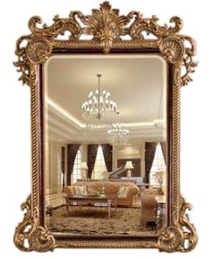 an ornate gold framed mirror with chandelier