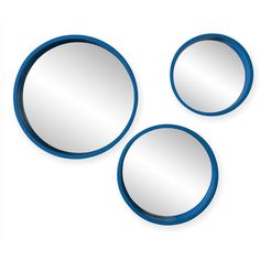 three round mirrors sitting next to each other on a white surface with blue trim around them