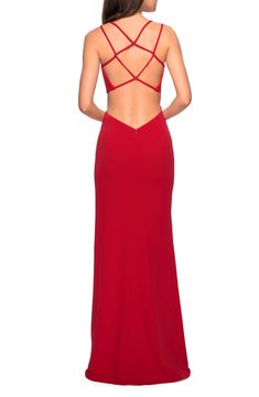 Dramatic, and just a bit daring, this fiery-red gown features an enticing web of straps at the open back, a notched waist and an all-about-those-legs slit. An abbreviated train beguiles from behind you. Style Name:La Femme High Slit Strappy Back Gown. Style Number: 5952178. Strappy Gown, Satin Formal Gown, Jersey Prom Dress, Long Red Dress, Full Length Skirts, Column Gown, Red Gowns, Floor Length Skirt, Sequin Gown