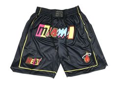 a pair of black shorts with colorful patches on them and the words miami printed on it