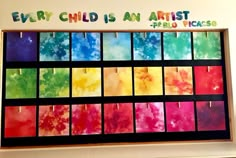 an art display with many different colors and words on the wall above it that says, every child is an artist