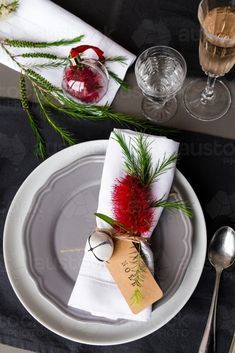 a place setting with silverware and napkins