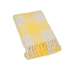 a yellow and white checkered blanket with fringes